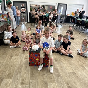 Magic Stuart presenting his magic rabbit during a live children’s performance
